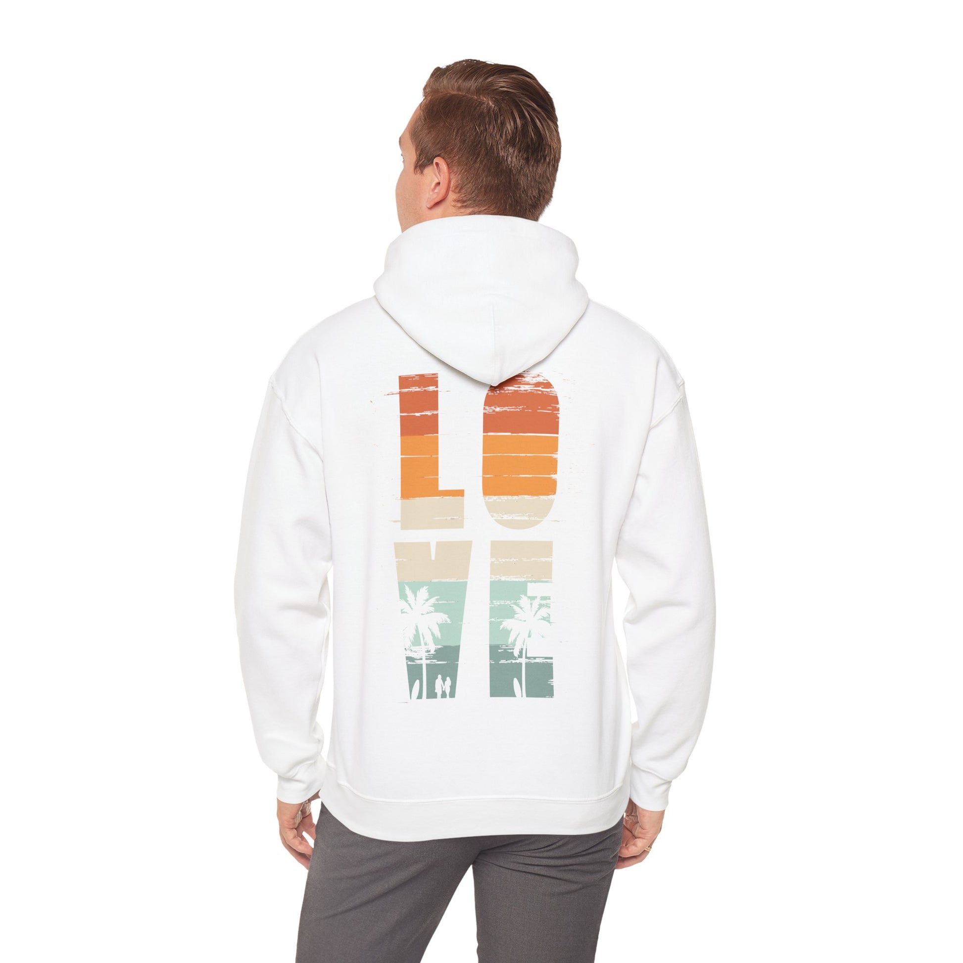 Charming model wearing the Vintage Love Hoodie in white, presenting the iconic back graphic with a sunset-inspired palette, epitomising modern fashion meets nostalgic flair.