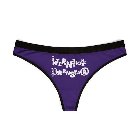 Luxurious purple thong featuring playful white text 'International Parnstar®' with a cheeky design, perfect for adding allure to intimate wear collections.