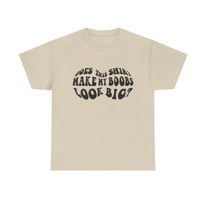 Elegant beige women's t-shirt featuring the humorous phrase 'Does This Shirt Make My Boobs Look Big?' in stylish black lettering, perfect for a fashionable statement.