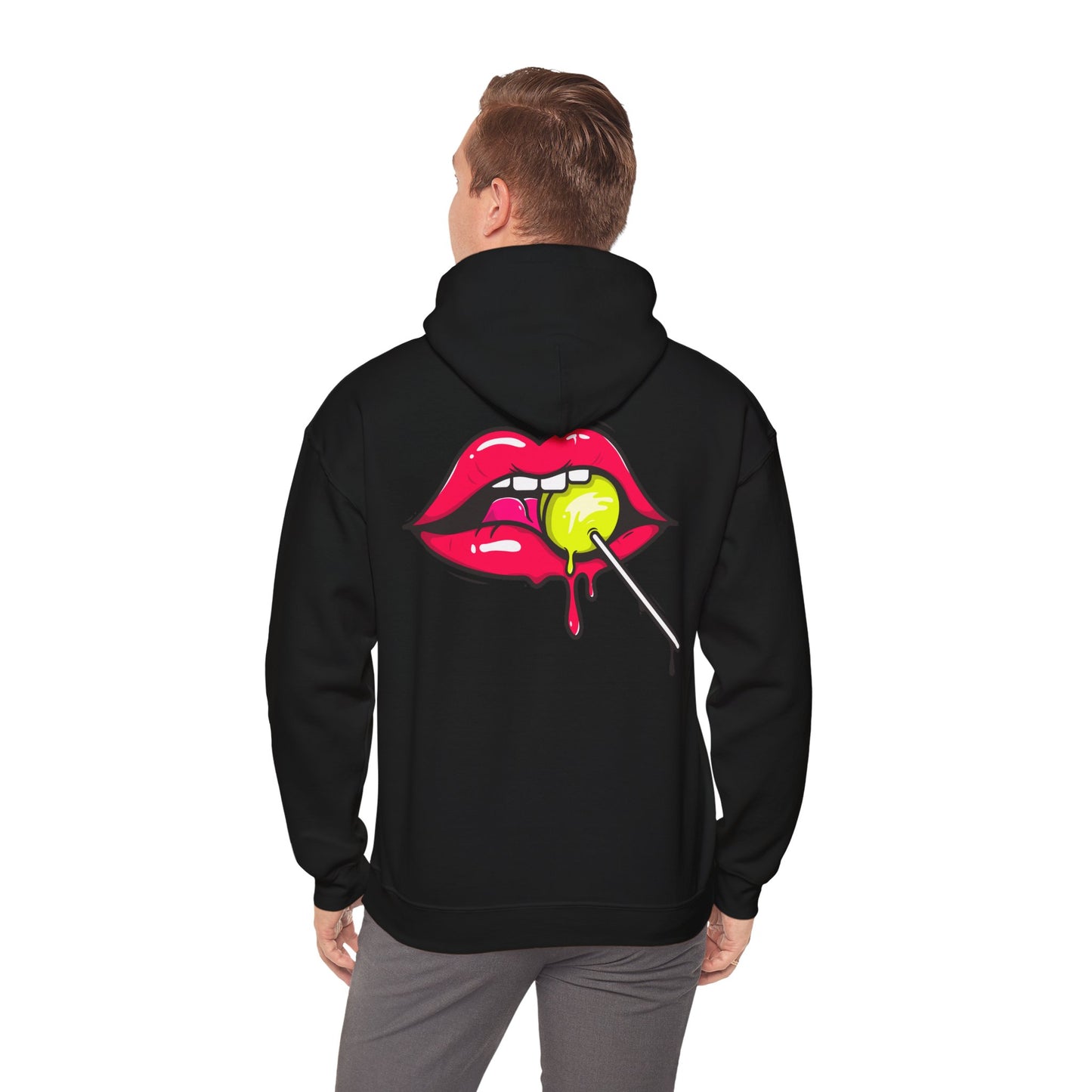 A man wearing a luxurious black hoodie with a striking back graphic of vibrant red lips holding a green lollipop, showcasing contemporary fashion.