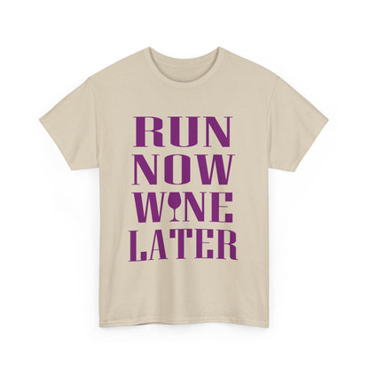 Stylish women's t-shirt showcasing the motivational phrase 'RUN NOW WINE LATER' in bold purple lettering, complemented with a wine glass graphic, perfect for fitness lovers.