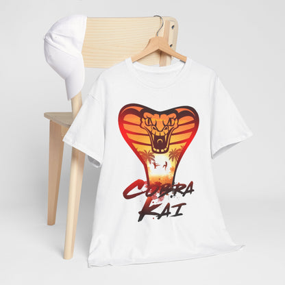 Luxurious Cobra Kai t-shirt artfully arranged on a wooden chair next to a hat, emphasising the striking snake graphic and casual elegance.