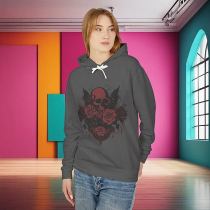 Model wearing a Unisex Lightweight Hooded Sweatshirt with a unique designer skull and roses graphic, showcasing a bold and stylish look in a vibrant setting.
