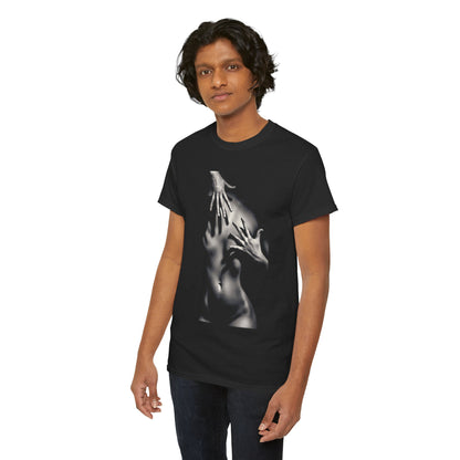 A handsome man in a luxurious black tee, elegantly printed with a creative portrayal of hands on a human silhouette, accentuating modern artistry.