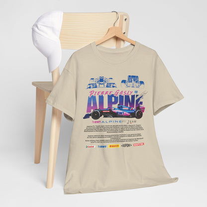 Luxurious Alpine F1 Team Men’s T-Shirt displayed on a wooden chair with a white cap, showcasing its bold graphic design and premium fabric, ideal for motorsport enthusiasts.
