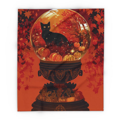 Luxurious Halloween-themed Arctic fleece blanket displaying a mystical black cat surrounded by pumpkins within a snow globe design, ideal for stylish seasonal decor.