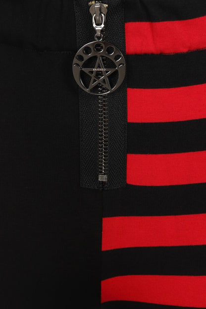 Luxurious high-waisted Banned leggings featuring a stunning half black and half red striped design, showcasing a moon phases zip pull for an elegant touch.