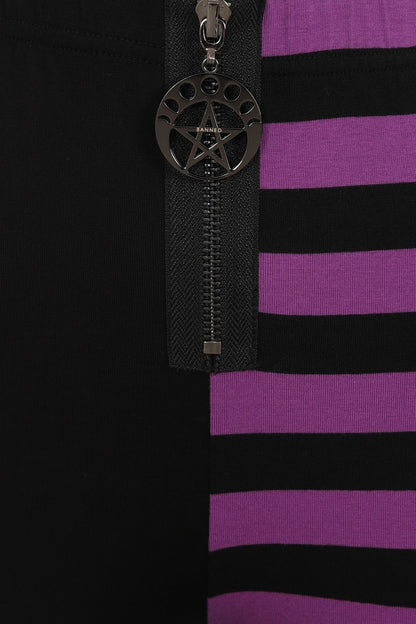 Close-up view of the soft, stretchy fabric of Banned Half Black Half Stripes Leggings, showcasing the luxurious high waist design and unique moon phases zip pull.