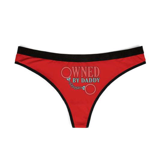 Elegant red women's thong displaying a humorous graphic reading 'Owned By Daddy' with handcuff motifs, ideal for adding a playful touch to intimate wear.