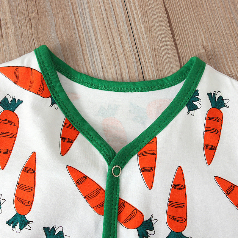 Close-up of the neckline of a Luxury Cotton Easter Baby Jumpsuit Romper featuring vibrant carrot patterns and a green trim, showcasing the premium soft fabric.