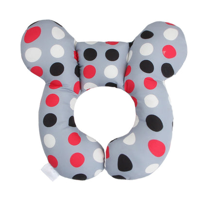 Elegant U-Shaped Infant Pillow by Dazzling Dreams Studio in a playful polka dot pattern, designed for maximum baby comfort and neck protection.