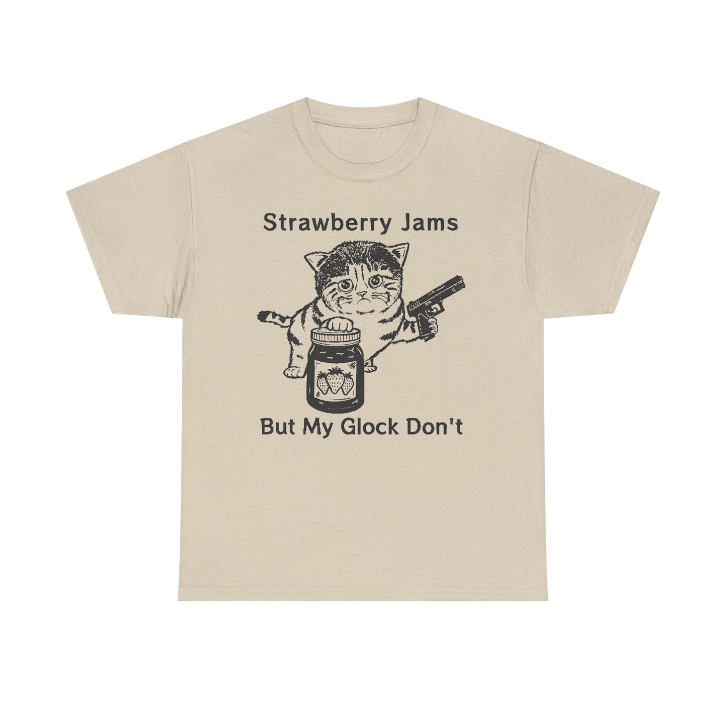 Luxurious beige graphic t-shirt featuring a playful cat holding a jar of strawberry jam and a handgun with the text 'Strawberry Jams But My Glock Don't.' Perfect for those who embrace unique style.