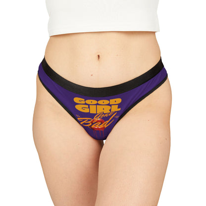 Luxurious purple thong panties featuring bold 'Good Girl Gone Bad' graphic design, elegantly styled with black trim.