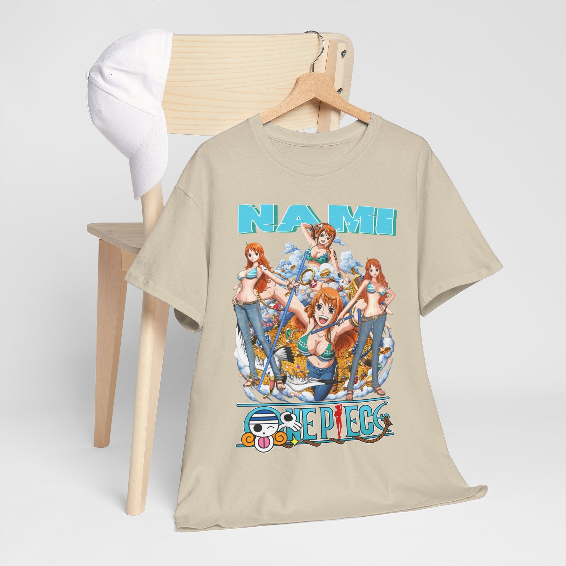 Stylish Nami anime t-shirt displayed on a wooden chair with a white cap, featuring vibrant artwork showcasing Nami in dynamic poses from the popular anime series, perfect for anime enthusiasts.
