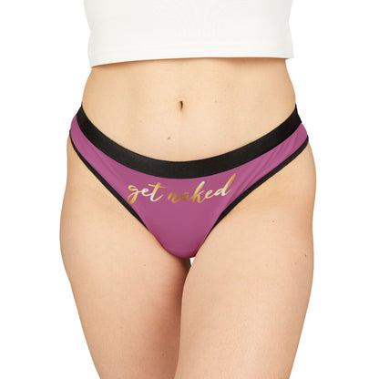 Luxury women's thong in rich plum with black trim featuring the provocative phrase 'get naked' elegantly scripted in gold, perfect for playful seduction on special occasions.