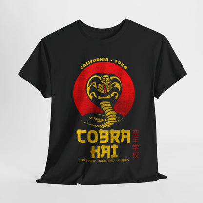 Luxurious unisex graphic tee featuring the iconic Cobra Kai logo with a coiled snake, set against a striking black backdrop. The design highlights 'Strike First, Strike Hard, No Mercy' text, embodying martial arts spirit and nostalgia for fans of the classic series.