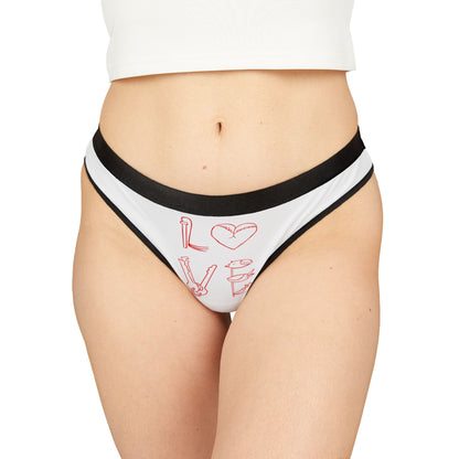 Elegant women's thong featuring playful romantic graphics, showcasing the word 'LOVE' with a heart design and sultry accents. Perfect for adding a cheeky touch to intimate wear.