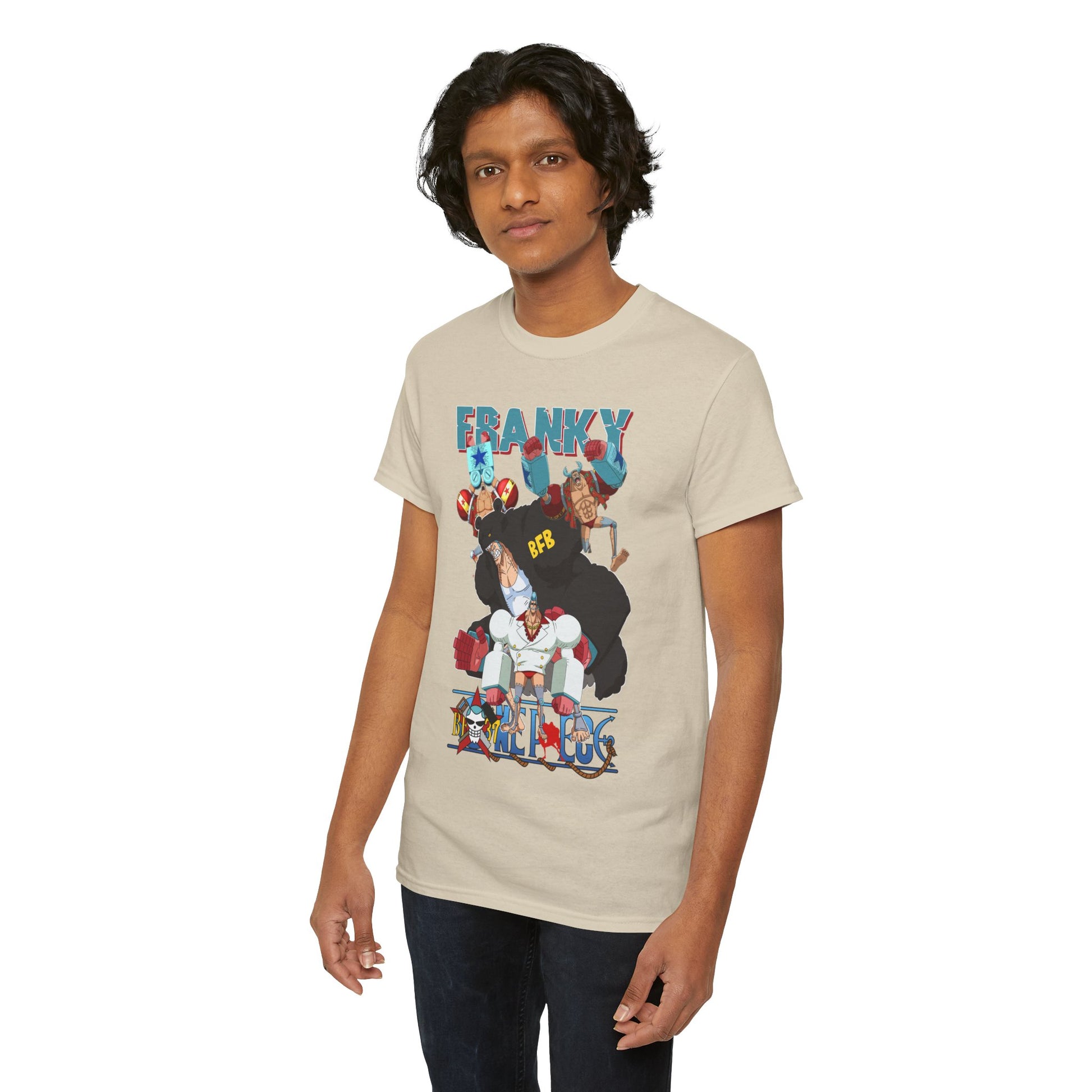 Fashionable male model wearing a beige t-shirt with an eye-catching Franky anime graphic, representing contemporary anime-inspired luxury.