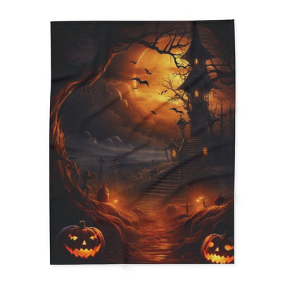 Decorative and Warm Halloween Spooky Arctic Fleece Blanket featuring a hauntingly beautiful design of a creepy house and glowing jack-o'-lanterns against an atmospheric night sky.
