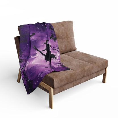 Chic Decorative and Warm Halloween Spooky Arctic fleece blanket draped over a stylish chair, featuring a whimsical design perfect for Halloween ambiance.