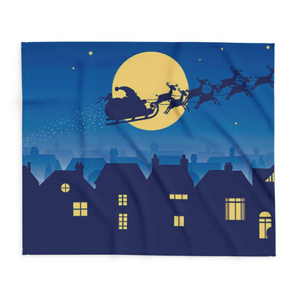 Decorative and Warm Christmas Arctic Fleece Blanket featuring a festive scene of Santa on a sleigh being pulled by reindeer against a starry night sky and a glowing full moon.