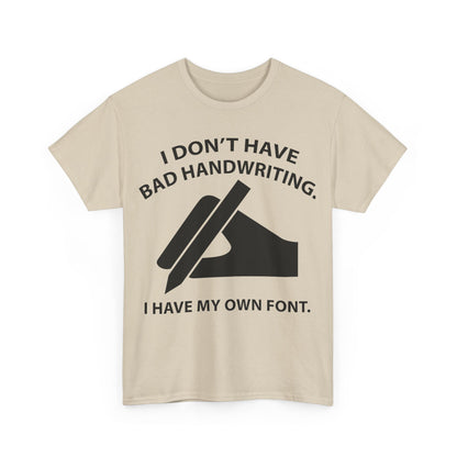 Front view of the I DON'T HAVE BAD HANDWRITING humorous graphic unisex T-shirt in cream, elegantly displaying the graphic design with 'I DON'T HAVE BAD HANDWRITING. I HAVE MY OWN FONT.' text and hand silhouette.