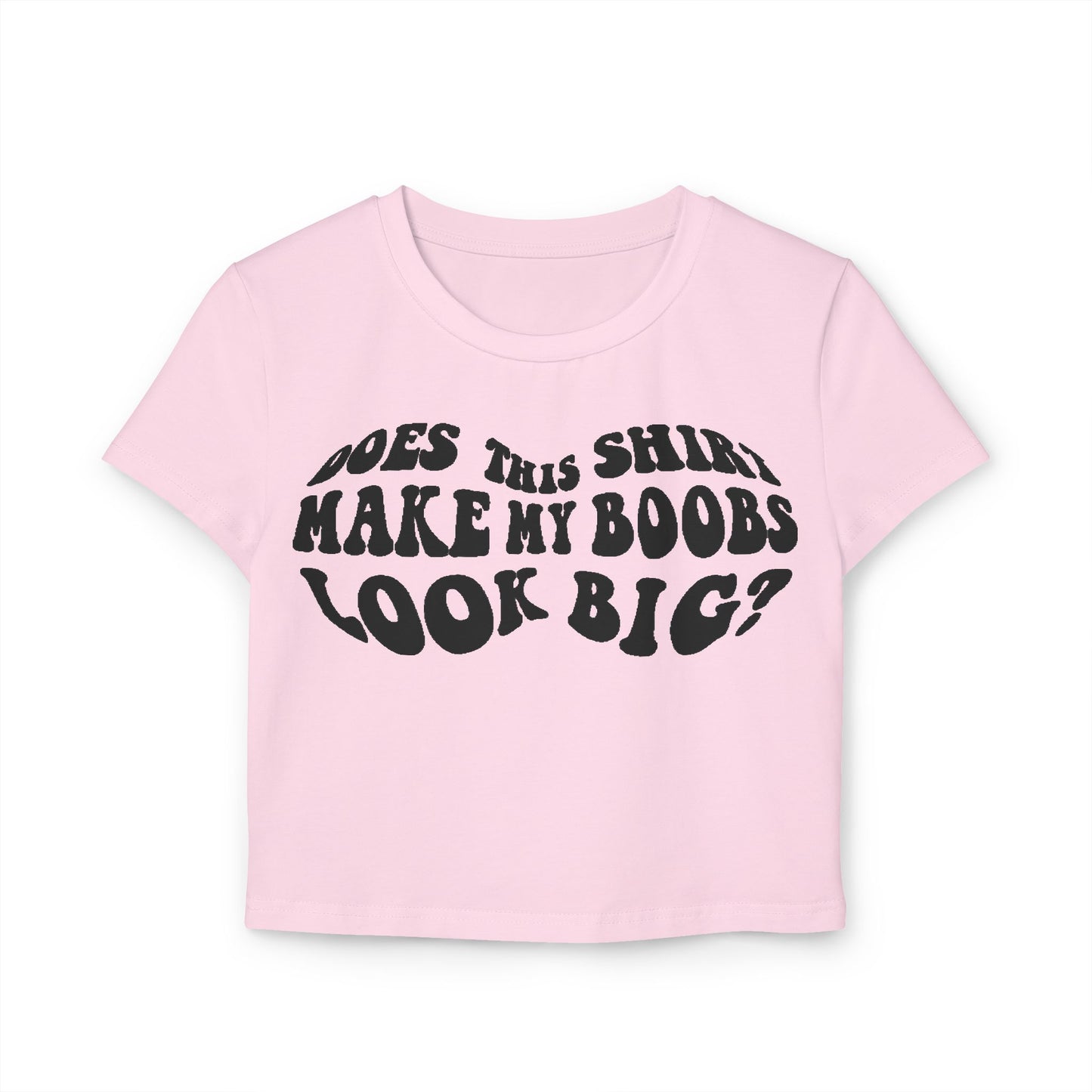Stylish pink women's t-shirt with the amusing slogan 'Does This Shirt Make My Boobs Look Big?' presented in a vintage typography, perfect for casual outings and a touch of fun.