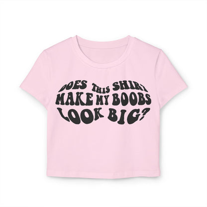 Stylish pink women's t-shirt with the amusing slogan 'Does This Shirt Make My Boobs Look Big?' presented in a vintage typography, perfect for casual outings and a touch of fun.