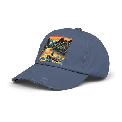Unisex Distressed Paddleboarders Cap showcasing a picturesque water scene, a stylish accessory for luxury water adventures.