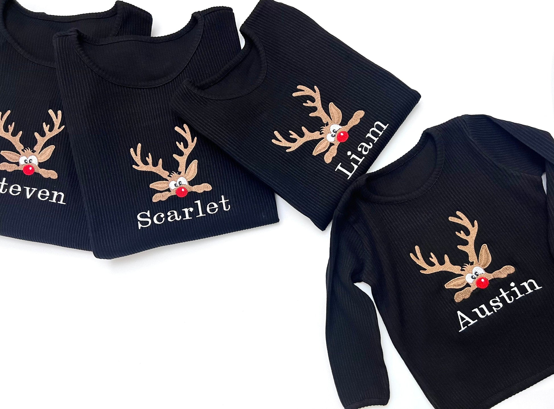 DreamBuy's luxurious Christmas Reindeer Lounge Set displaying matching pyjamas for the whole family in a cozy, festive style.