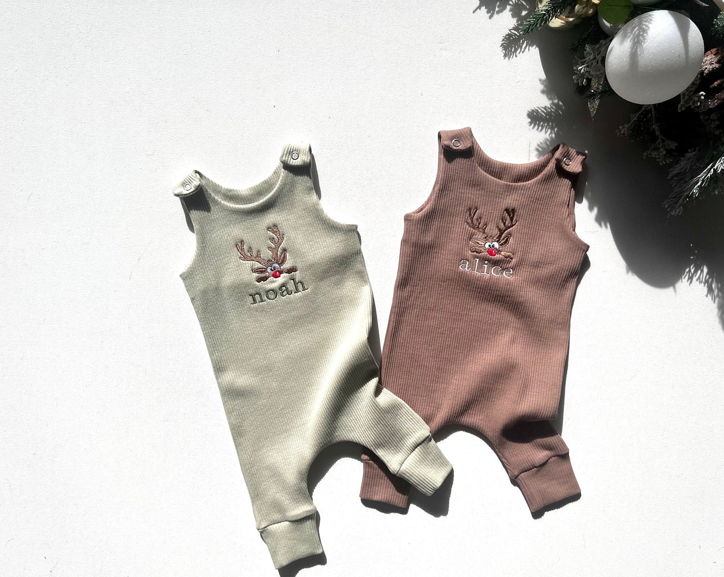 Beautifully crafted luxury baby dungarees by DreamBuy, adorned with reindeer embroidery, perfect for magical Christmas moments.