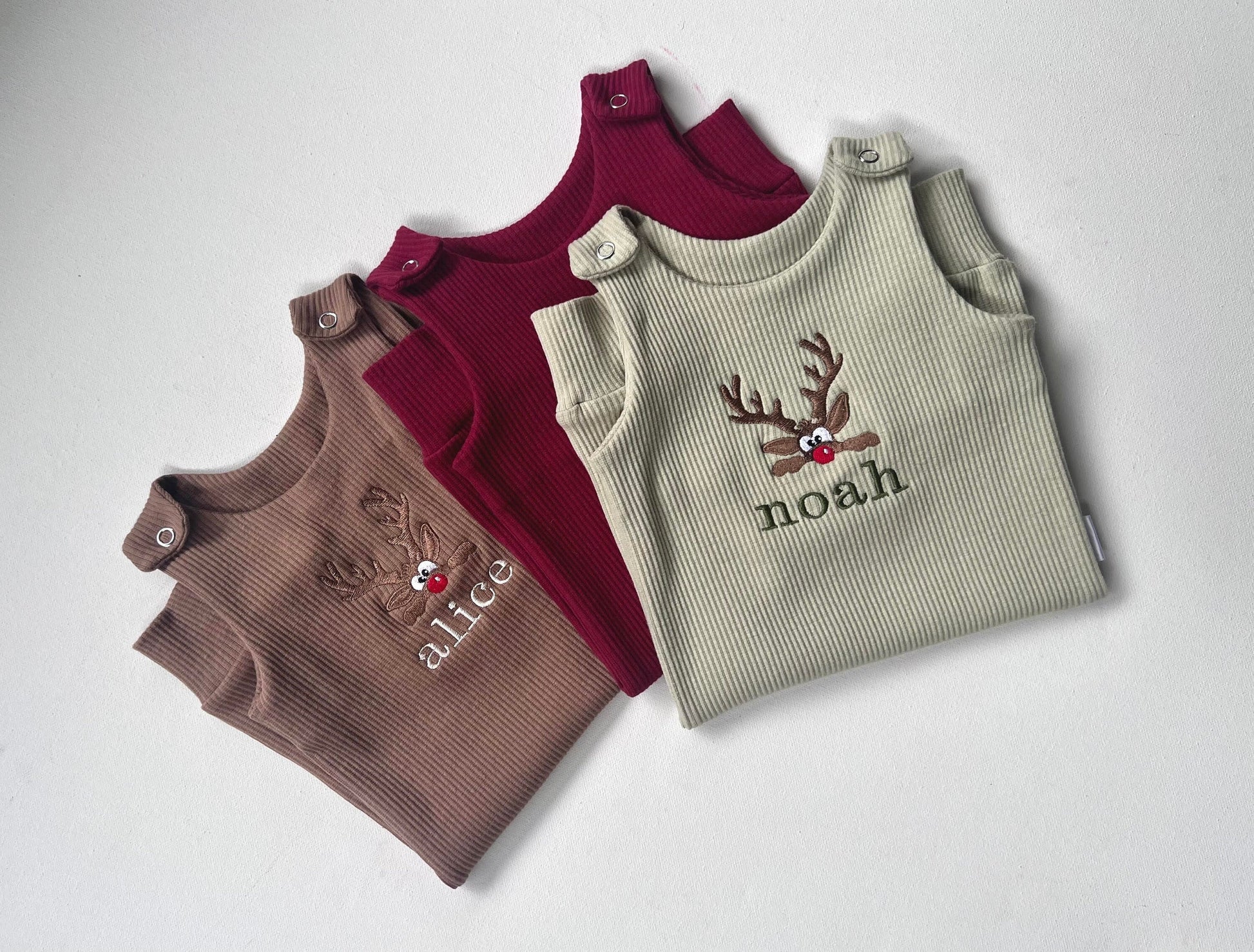 Luxury baby Christmas dungarees with embroidered reindeer design, perfect for first Christmas celebrations by DreamBuy.