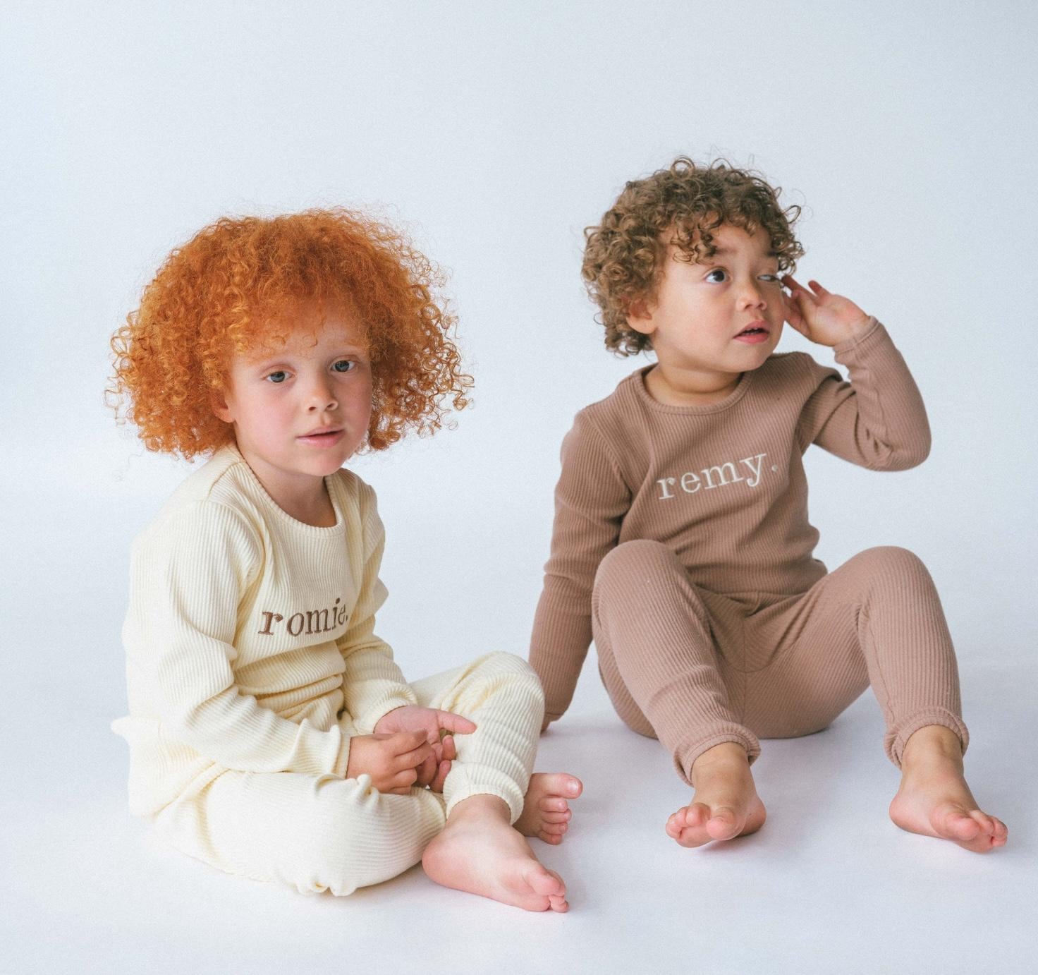 Elegant family wearing DreamBuy matching Christmas pyjamas set, showcasing soft ribbed lounge wear for all sizes from 3M to XXL.