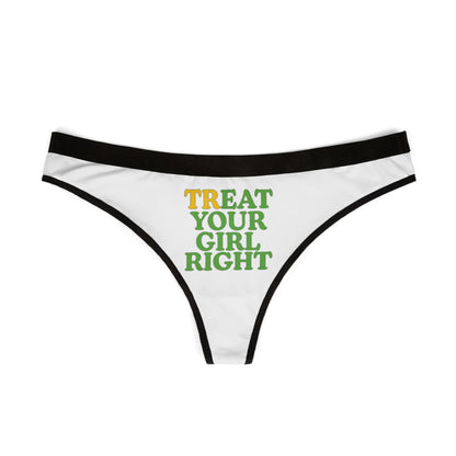 Exquisite white thong featuring playful 'TREAT YOUR GIRL RIGHT' phrase in eye-catching yellow and green, framed by a sophisticated black waistband.