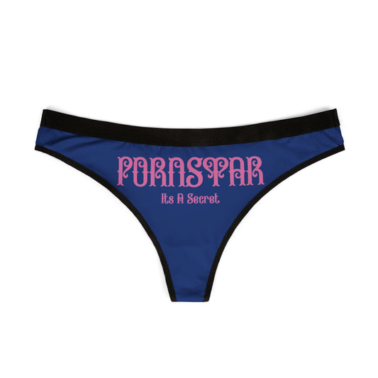 Elegant thong panties showcasing a bold 'PORNSTAR It's A Secret' graphic on a chic blue backdrop, perfect for adding a playful touch to any lingerie collection.