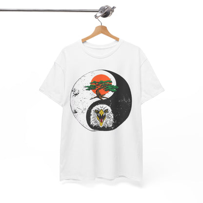 Elegant display of a unisex t-shirt hanging on a wooden hanger, featuring a striking yin-yang design with a formidable eagle and a serene bonsai tree, symbolising balance and strength.