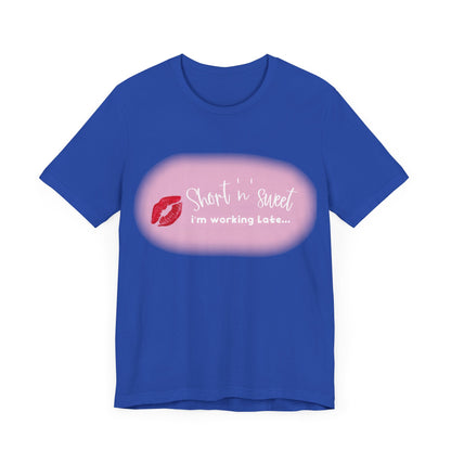 Front view of a captivating vibrant blue t-shirt adorned with 'Short 'n' Sweet, I'm Working Late...' text and lipstick print, inspired by Sabrina Carpenter.