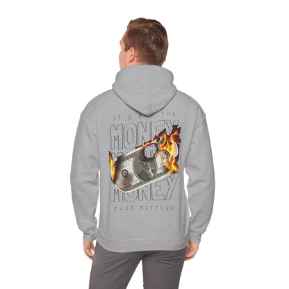 Model wearing a grey hoodie with an eye-catching 'IT'S NOT THE MONEY' graphic on the back, embodying bold style and comfort.