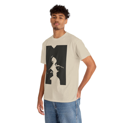 Classy male model wearing a unisex graphic t-shirt with a distinctive black and white illustration, exuding charisma and style in casual elegance.