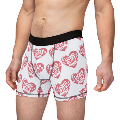 Model showcasing Valentines Naughty Cheeky Men's Boxer Briefs with a bold text design, capturing the essence of fun and romance for birthdays or anniversaries.