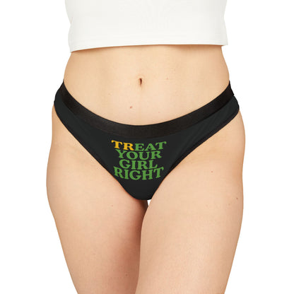 Sophisticated display of a women's cheeky thong adorned with the text 'TREAT YOUR GIRL RIGHT', showcasing its exquisite design and inviting charm on a model.