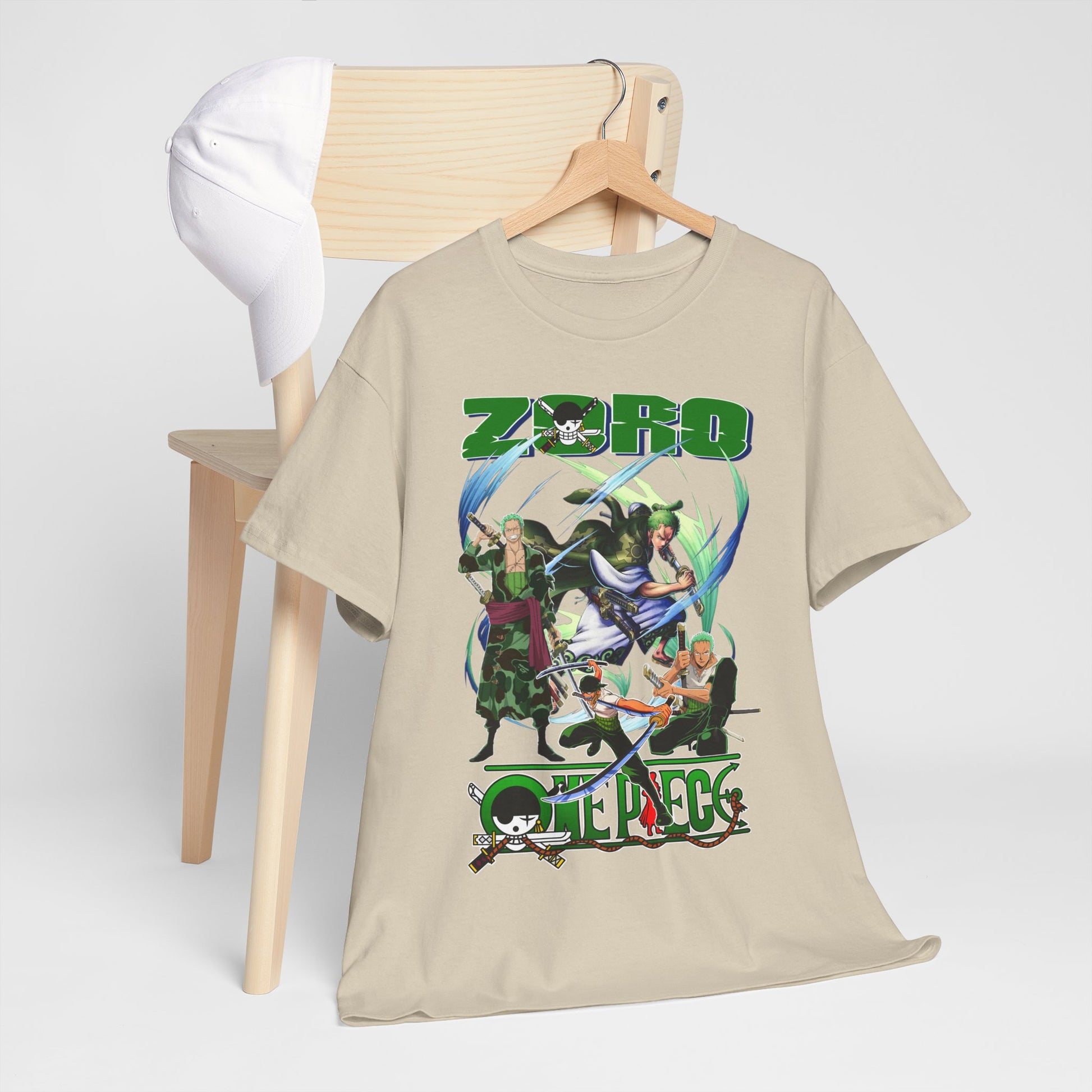Stylish One Piece t-shirt elegantly displayed on a wooden chair alongside a cap, showcasing vibrant graphics of Zoro and fellow characters.