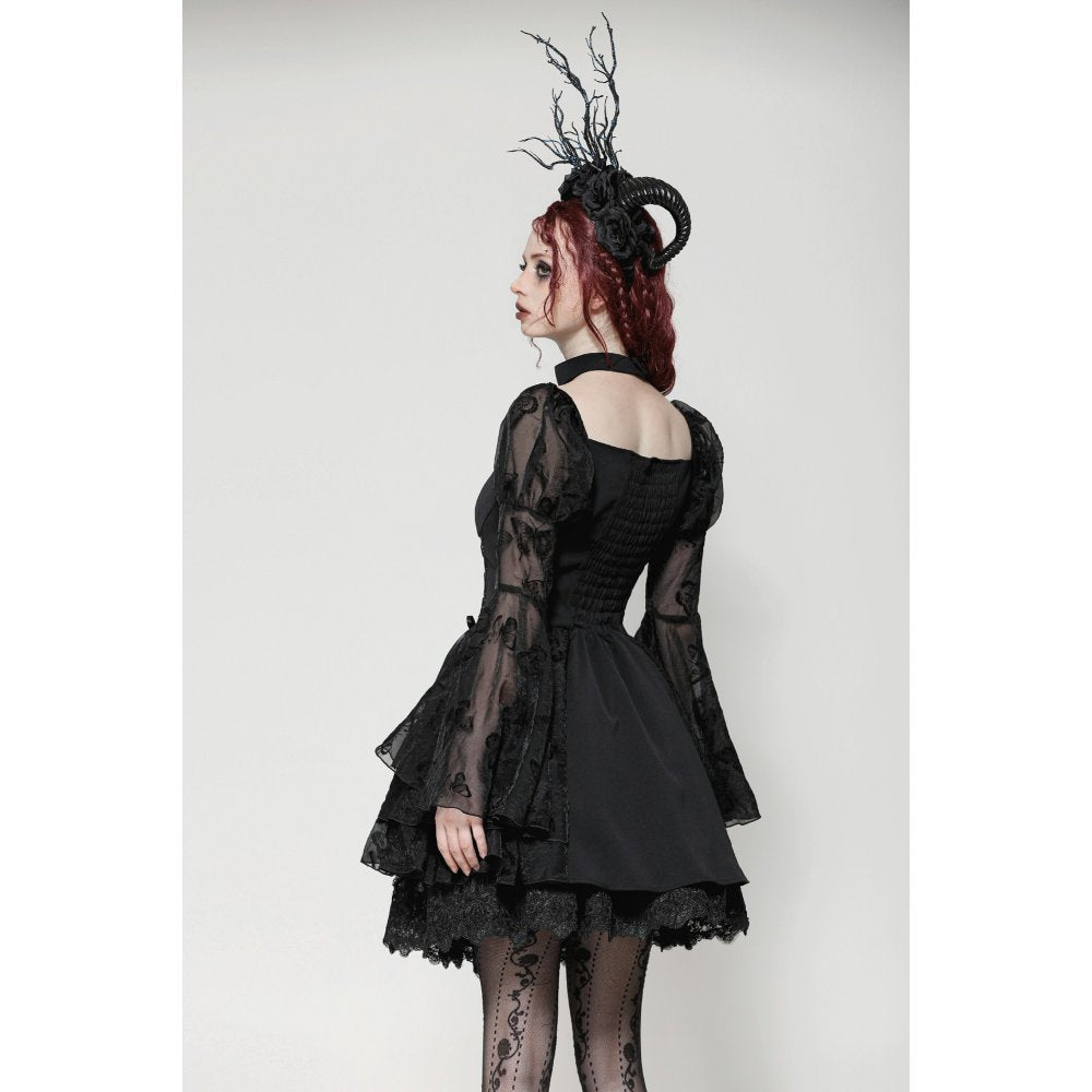 Model wearing the Dark In Love Blanche Victorian gothic dress, illustrating the dress's theatrical elegance and dramatic flair in a luxurious setting.