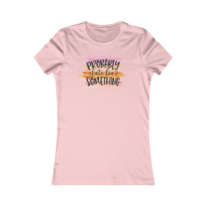Light pink women's t-shirt featuring the artistic statement 'Probably Late for Something' in striking lettering, set against a dreamy watercolor background.