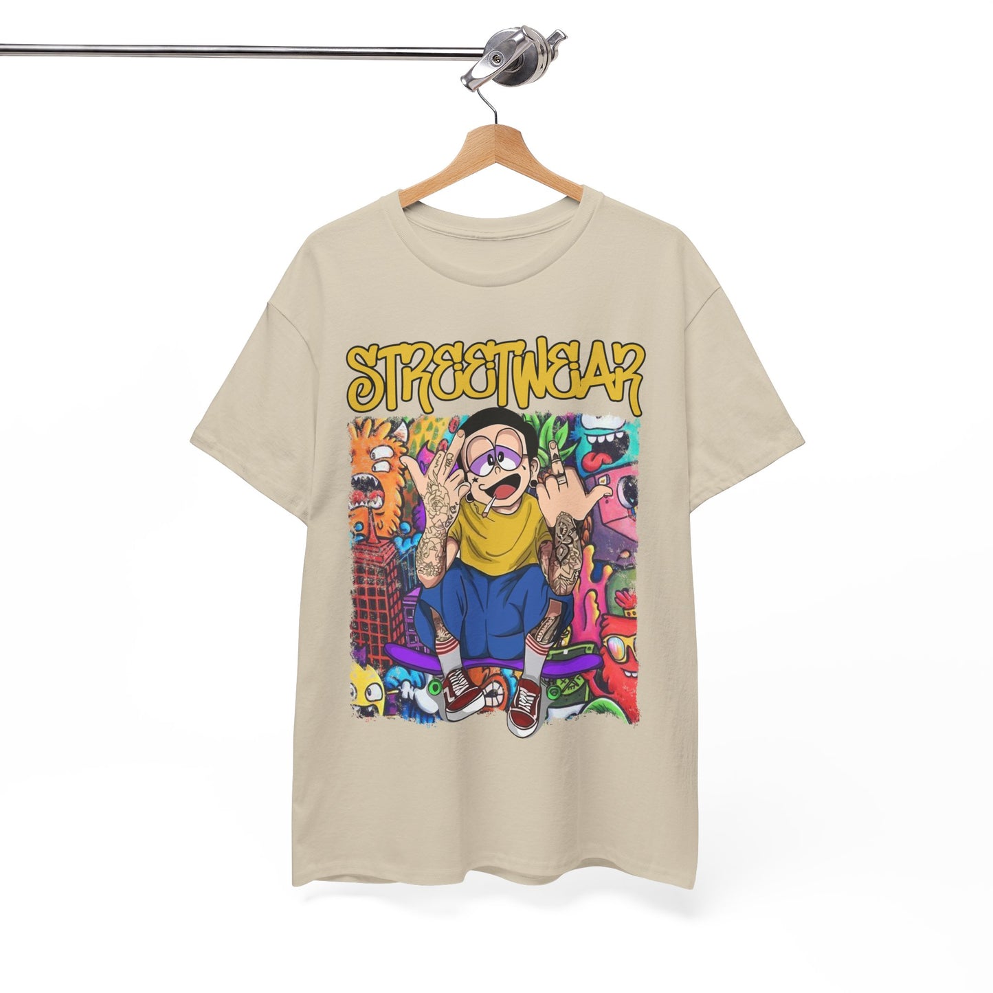 Stylish beige t-shirt displayed on a hanger, adorned with a striking cartoon illustration and bold ‘STREETWEAR’ typography, embodying contemporary urban fashion.