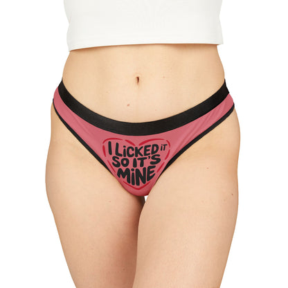 Cheeky women's thong in pink with black trim featuring the playful slogan 'I Licked It So It's Mine', perfect for Valentine's Day gifts.
