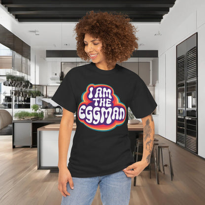Chic I Am The Eggman Graphic T-Shirt worn by a stylish model in a modern kitchen, enhancing personal style with a statement piece.