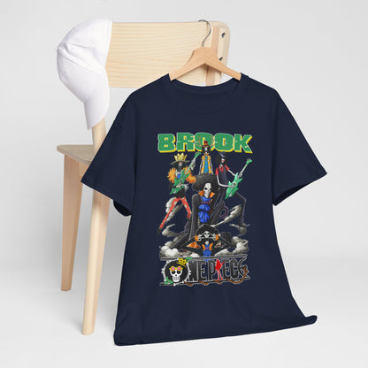Elegant navy t-shirt displayed on a wooden hanger beside a stylish cap. The design features famous anime characters in a visually striking composition with the word 'BROOK' prominently featured.