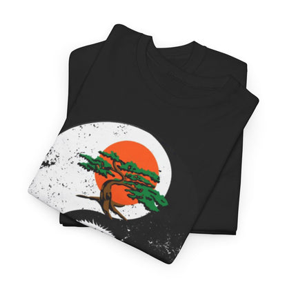 Stylish folded black graphic t-shirts layered together, each adorned with intricate yin-yang art depicting a majestic bonsai tree and an eagle, representing martial arts philosophy.