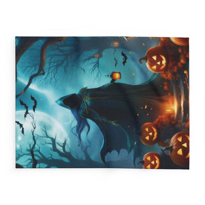 Decorative and Warm Halloween Spooky Arctic Fleece Blanket featuring a haunting scene with a robed figure and glowing jack-o'-lanterns under a full moon, perfect for luxurious Halloween celebrations.